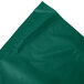 A folded hunter green plastic table skirt.