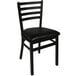 A BFM Seating black steel side chair with black vinyl seat.