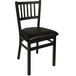 A BFM Seating Troy black metal side chair with a black cushion.