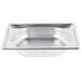 A Vollrath stainless steel hexagon pan on a silver tray with a white background.