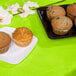 A table set with a Fresh Lime Green Tissue / Poly Table Cover and muffins.