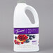 A white jug of milk with a purple label next to a bottle of Torani Blueberry Pomegranate Fruit Smoothie Mix.