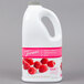 A white jug of Torani Raspberry Fruit Smoothie Mix with a handle and a label.