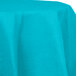 A Bermuda Blue OctyRound table cover on a table with a white surface.