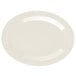 A white oval platter with a diamond ivory rim on a white background.