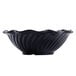 A black dessert dish with a curved edge and wavy lines.