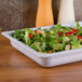 A salad in a white GET Melamine food pan.