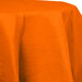 A Sunkissed Orange OctyRound table cover on a table with a white background.