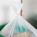 A plastic bag with orange Bedford Industries Inc. twist ties.