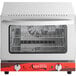 A silver Avantco countertop convection oven with a red and white handle and a metal grid inside.