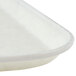 A close up of a white Cambro fiberglass tray with a trapezoid design.