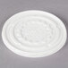 A white plastic lid with text that reads "Dinex" in a circular design.