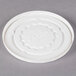 A white plastic lid for a Dinex Tropez bowl with text on it.