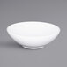 An Elite Global Solutions Sunburst white melamine bowl with a handle.