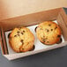 A Baker's Mark reversible cupcake and muffin insert holding two muffins in a box.