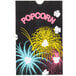A black Bagcraft Packaging popcorn bag with colorful fireworks on it.
