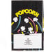 A black Bagcraft popcorn bag with yellow and pink text and a colorful design of yellow, pink, and white flowers.