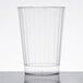 A Fineline clear plastic tumbler with a silver rim on a white surface.