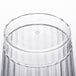 A close up of a Fineline clear hard plastic crystal tumbler with a small hole in it.