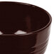 A brown Tablecraft cast aluminum bowl with a black speckled rim.
