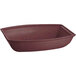 A maroon rectangular Tablecraft salad bowl with a speckled white interior.