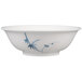 A white bowl with blue leaves and bamboo design on it.