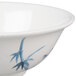 A close-up of a Thunder Group Blue Bamboo melamine bowl with a blue and white bamboo design.