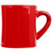 A red coffee mug with a handle.