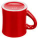 A red mug with a white handle.