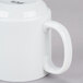 A close up of a bright white CAC Venice stacking mug with a handle.