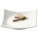 A CAC Super White Square Porcelain Sushi Plate with food on it.