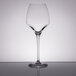 A close-up of a clear Chef & Sommelier wine glass.
