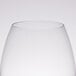 A close up of a clear Chef & Sommelier universal wine tasting glass.