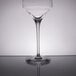 A close-up of a Chef & Sommelier Universal Wine Tasting Glass by Arc Cardinal with a white rim on a table.