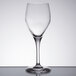 A close-up of a Chef & Sommelier wine glass on a table.