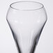 A close-up of a clear Chef & Sommelier flute glass with a rim.
