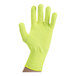 A hand wearing a yellow Victorinox cut resistant glove with a finger extended.