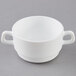 A white Arcoroc double handled bowl on a white background.