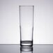 A clear Libbey tall highball glass on a table.