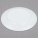 An Arcoroc white glass bread and butter plate with a circular design on the edge.
