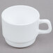 An Arcoroc white coffee cup with a white handle on a grey surface.