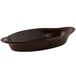 A brown oval Tuxton dish with a handle.