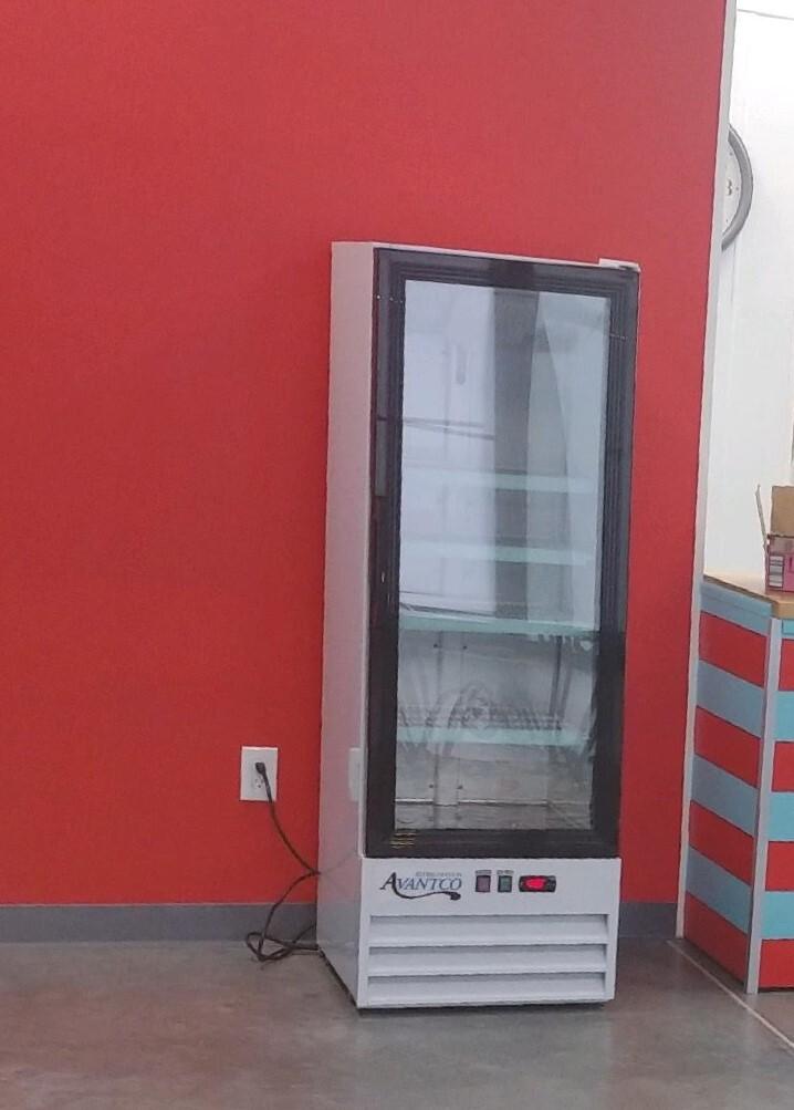 Drink refrigerator placed by the front counter.