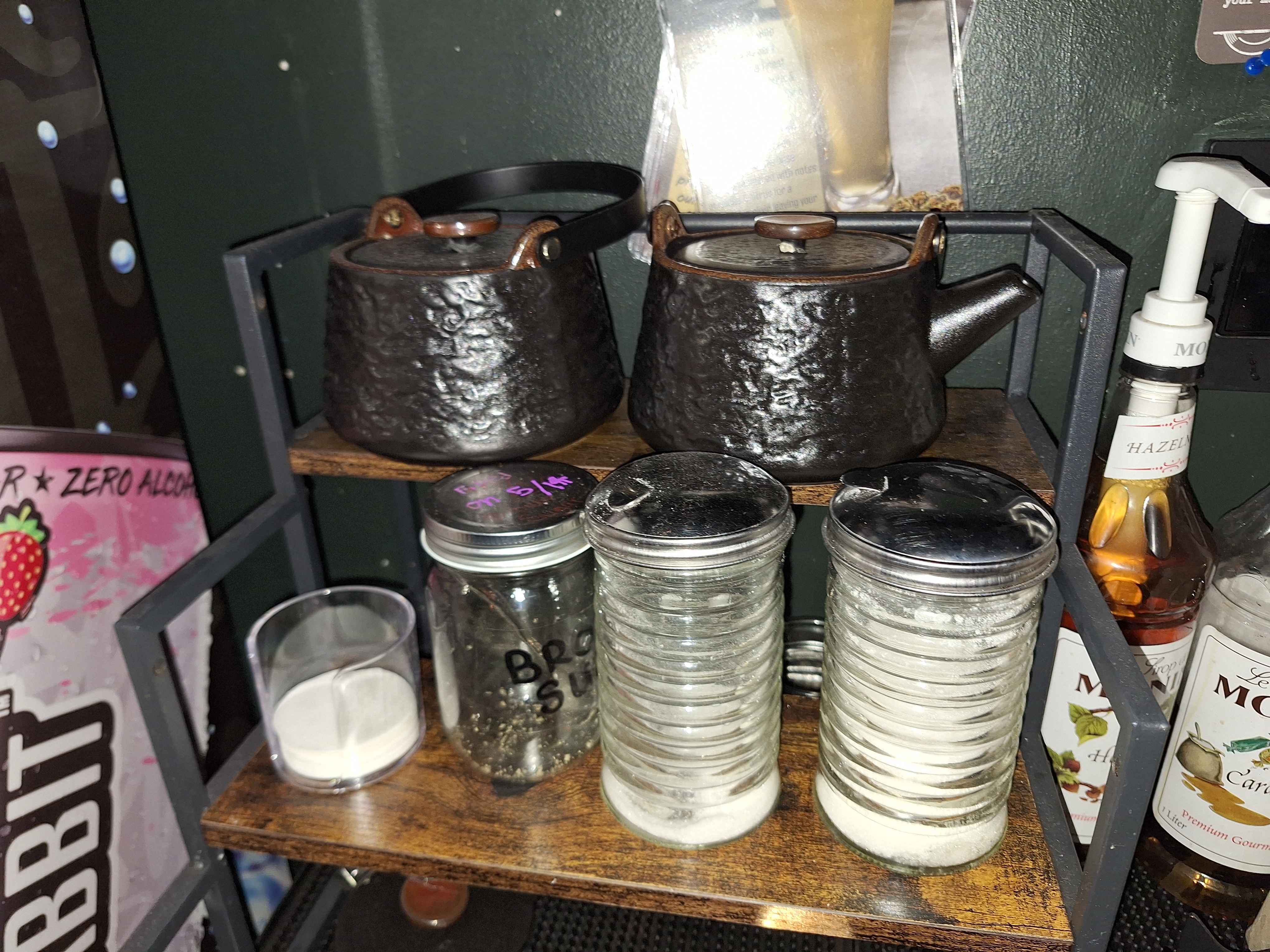 Our tea pot hanging out with their identical twin friends the sugar dispensers.