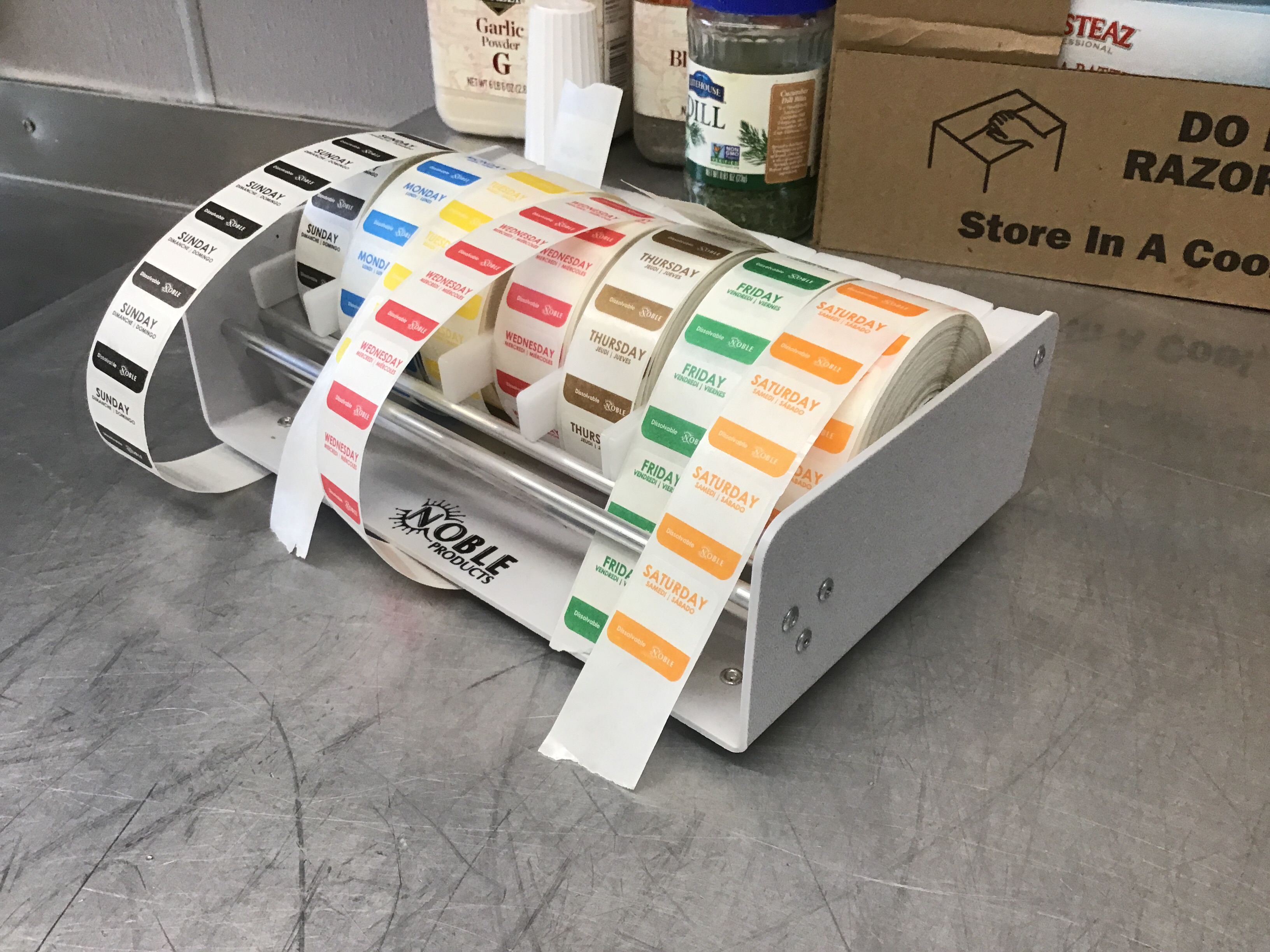 Day of the week sticker dispenser rack