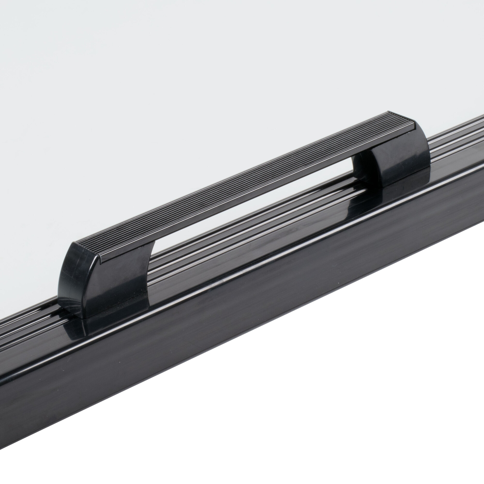 A black metal rectangular refrigerator door with a handle.