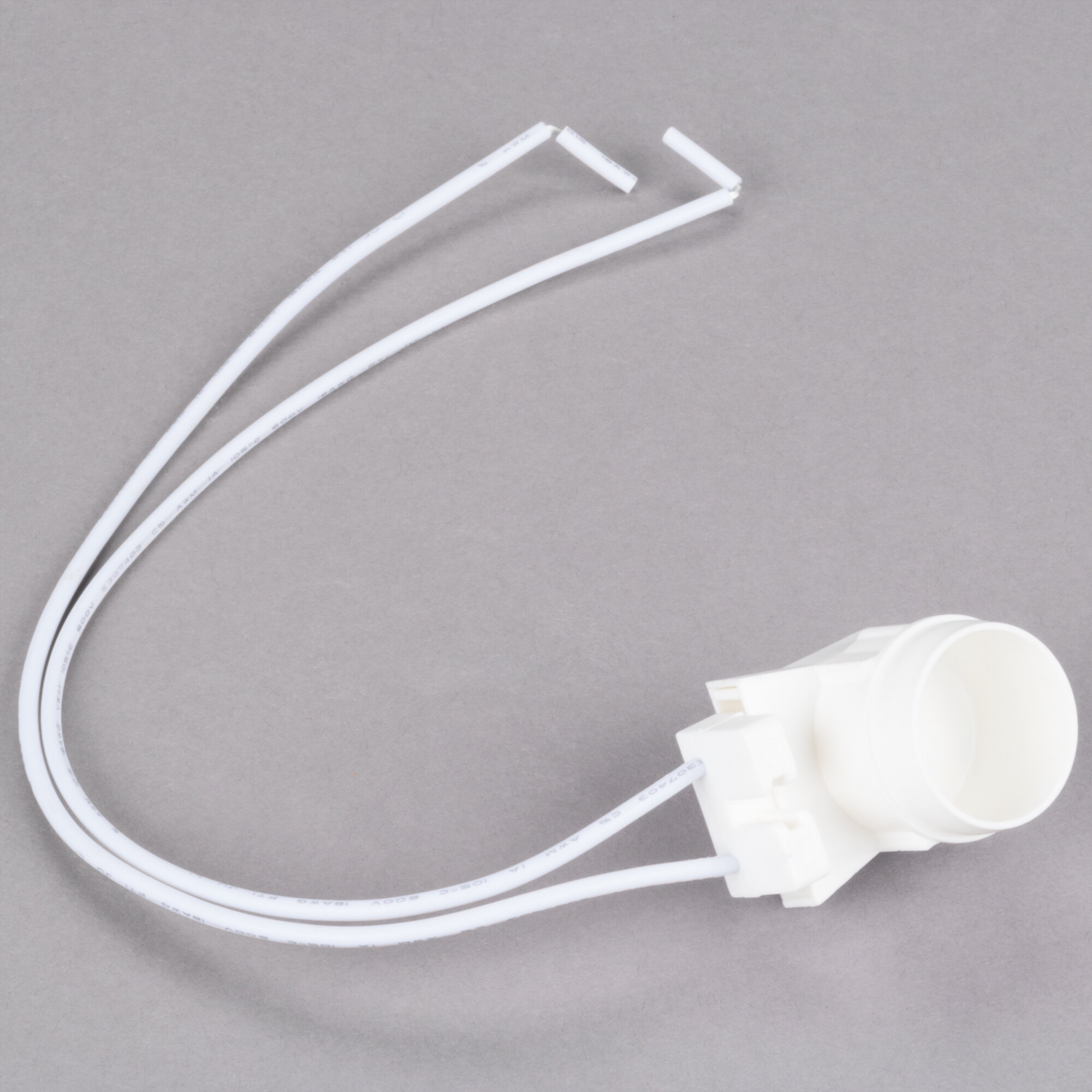 A white plastic light socket assembly with two wires and a hole.