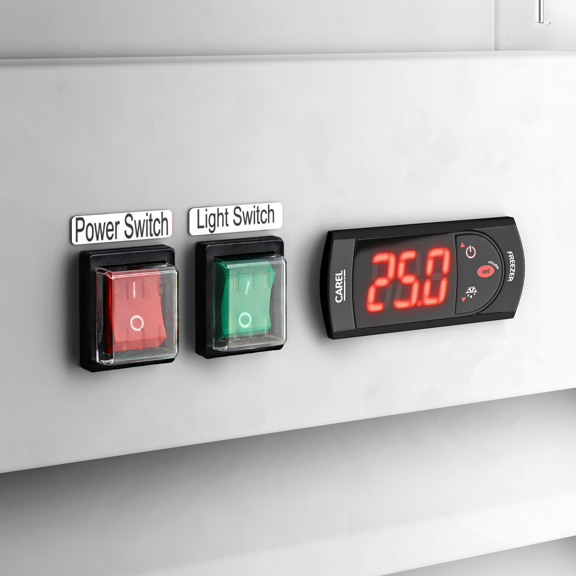 A control panel with a red power switch, a green light switch, and a digital temperature display on an ice merchandiser.