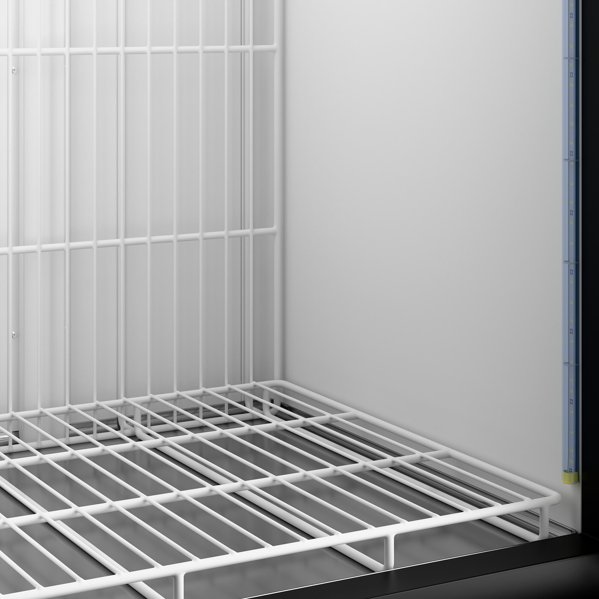 A white wire shelf inside an Avantco GD-ICE-49F indoor glass door ice merchandiser.