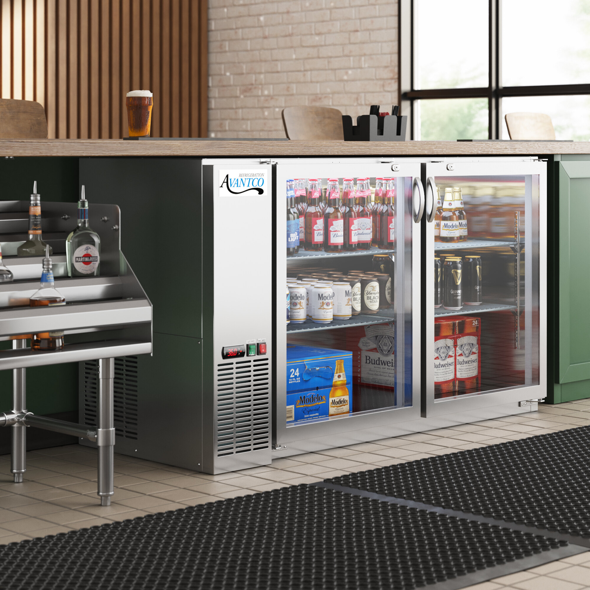 An Avantco back bar refrigerator with drinks on a metal shelf.